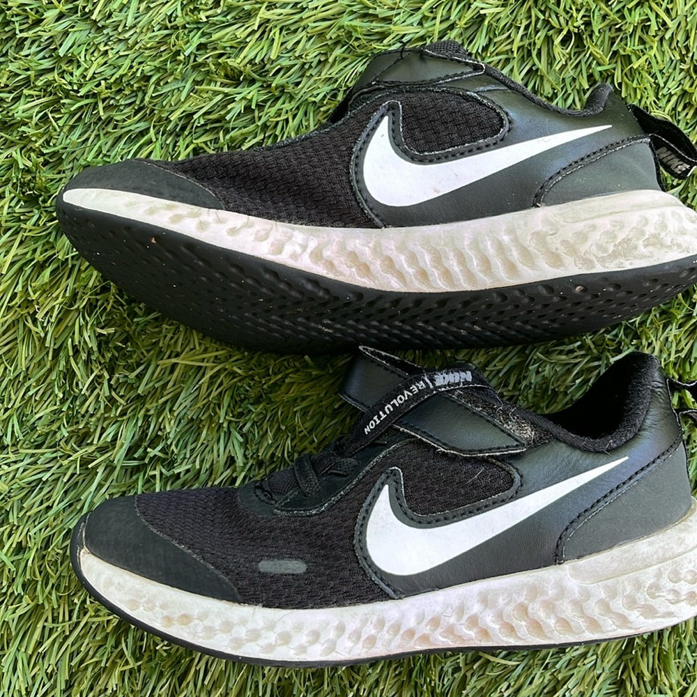 Nike revolution kids shoes , black